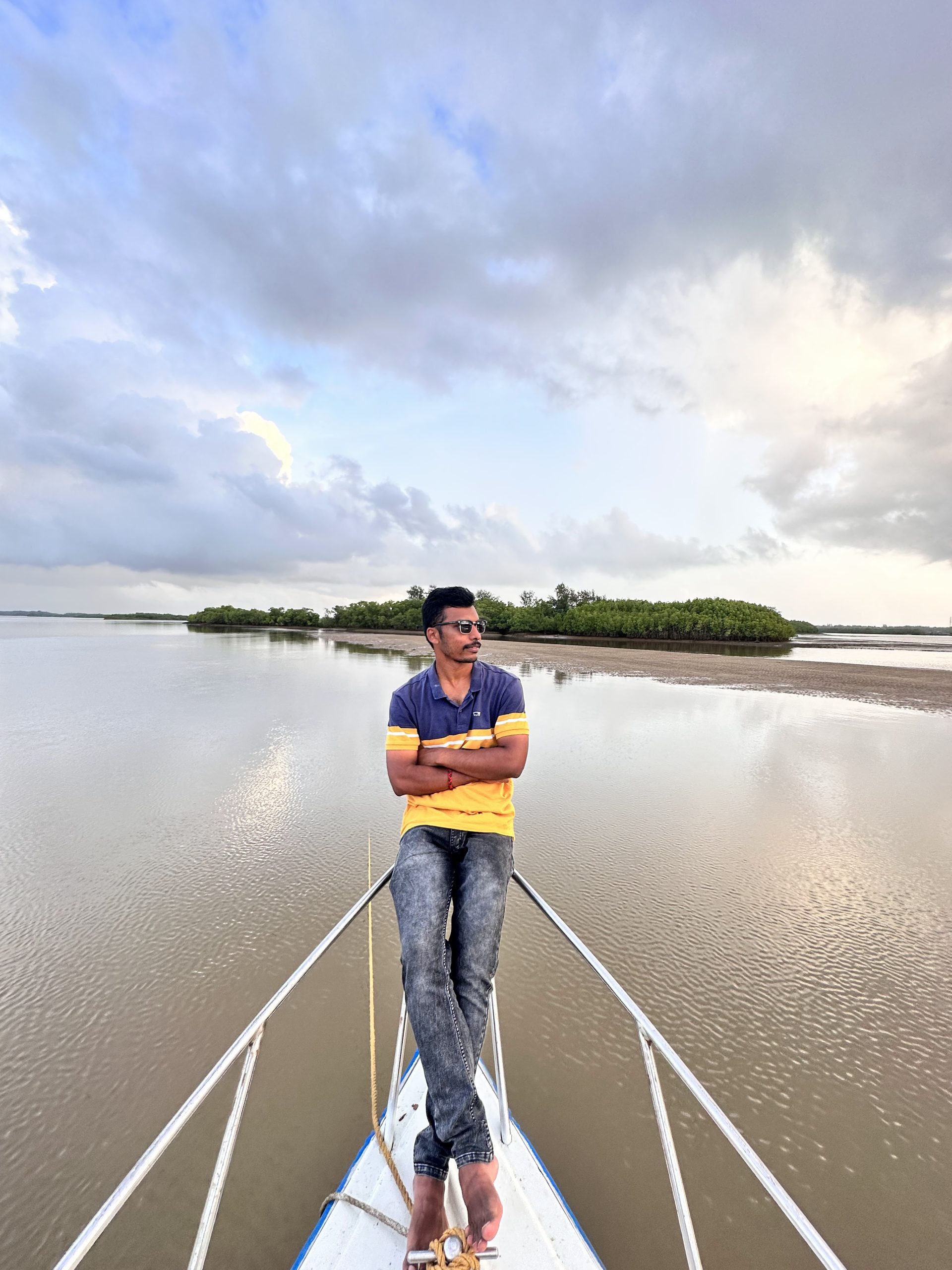 Boy standing on a boat in gokarna