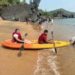 couple kayaking in beach